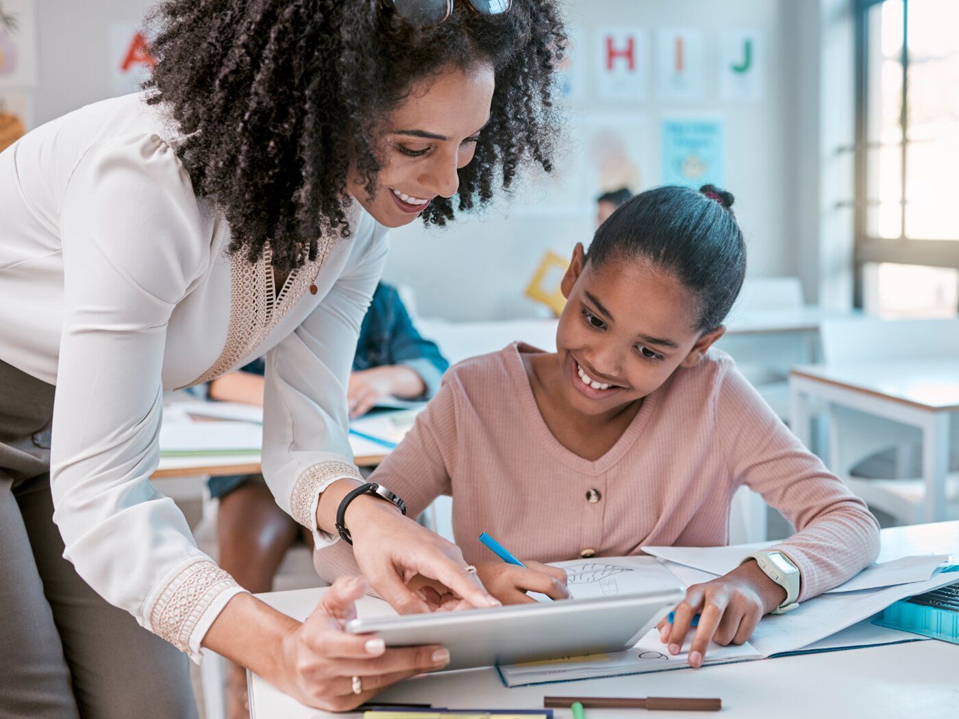 Teacher helping student