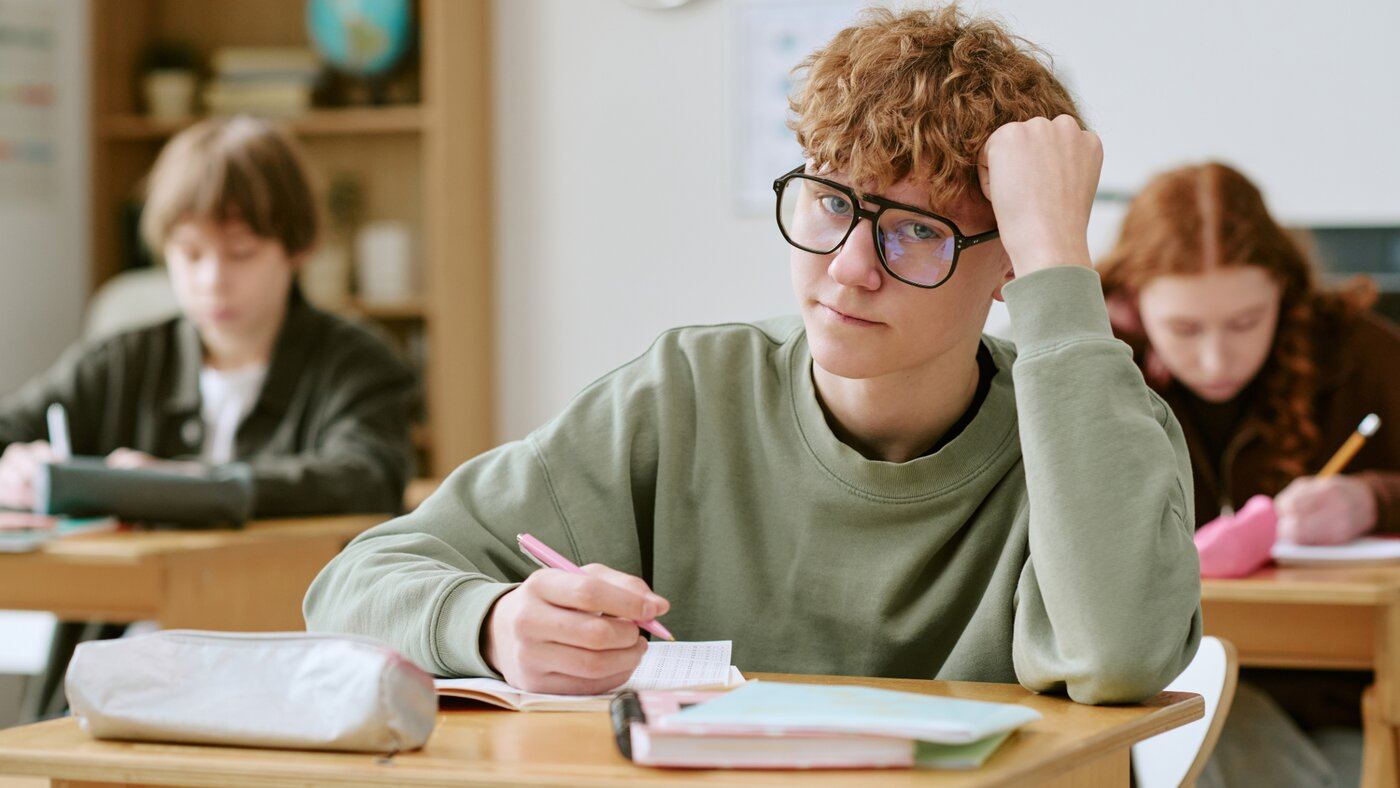 HS student writing classroom