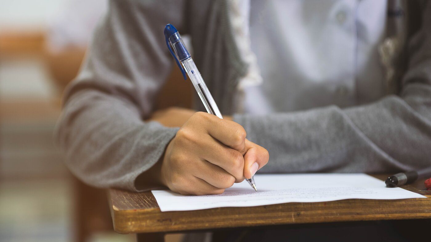 Student desk writing